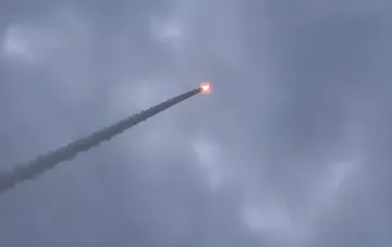 Launch of a new Ukrainian rocket in the sky with a smoky trail and bright engine flame