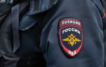 Russian police patch on uniform — symbol of investigation into ex-Sheremetyevo director’s death and Prigozhin’s plane crash