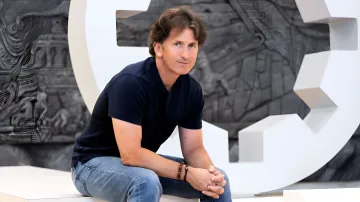 Todd Howard, creator of Skyrim and Fallout, sits in a relaxed pose, showing readiness to continue working on his projects.