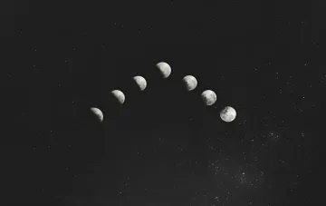 Phases of the Moon against a starry sky — illustration for the article on the candidate for the first exomoon and the challenges in confirming its status