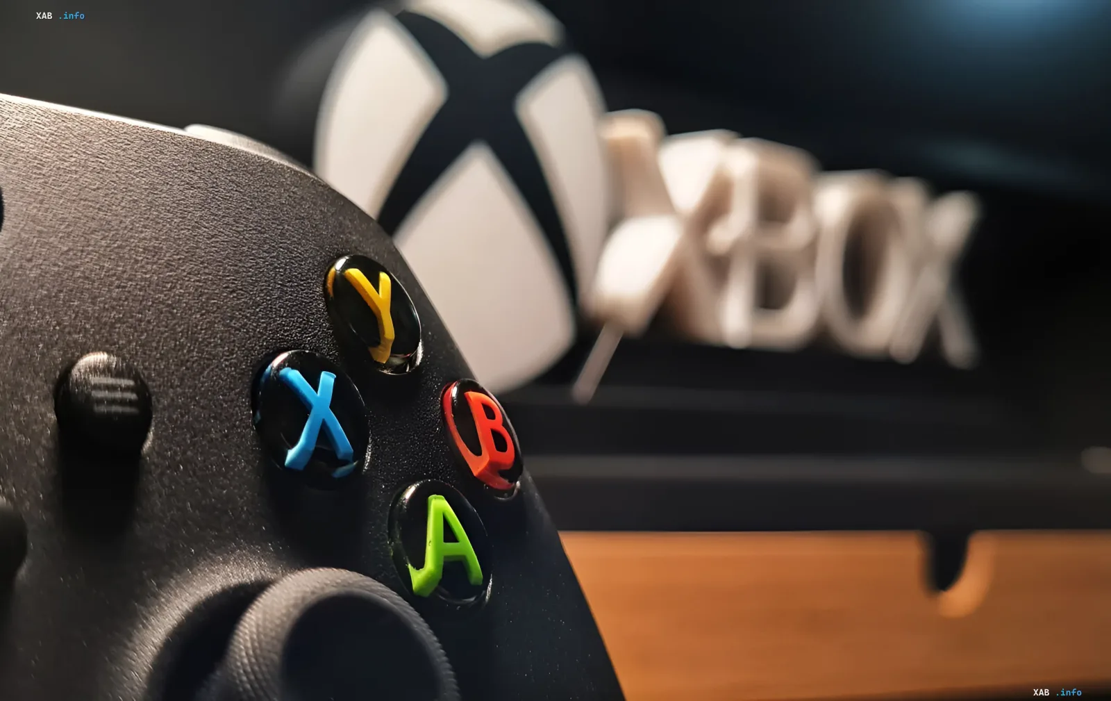 Xbox controller with A, B, X, Y buttons and Xbox logo in the background, symbolizing the launch of original Xbox games on PC