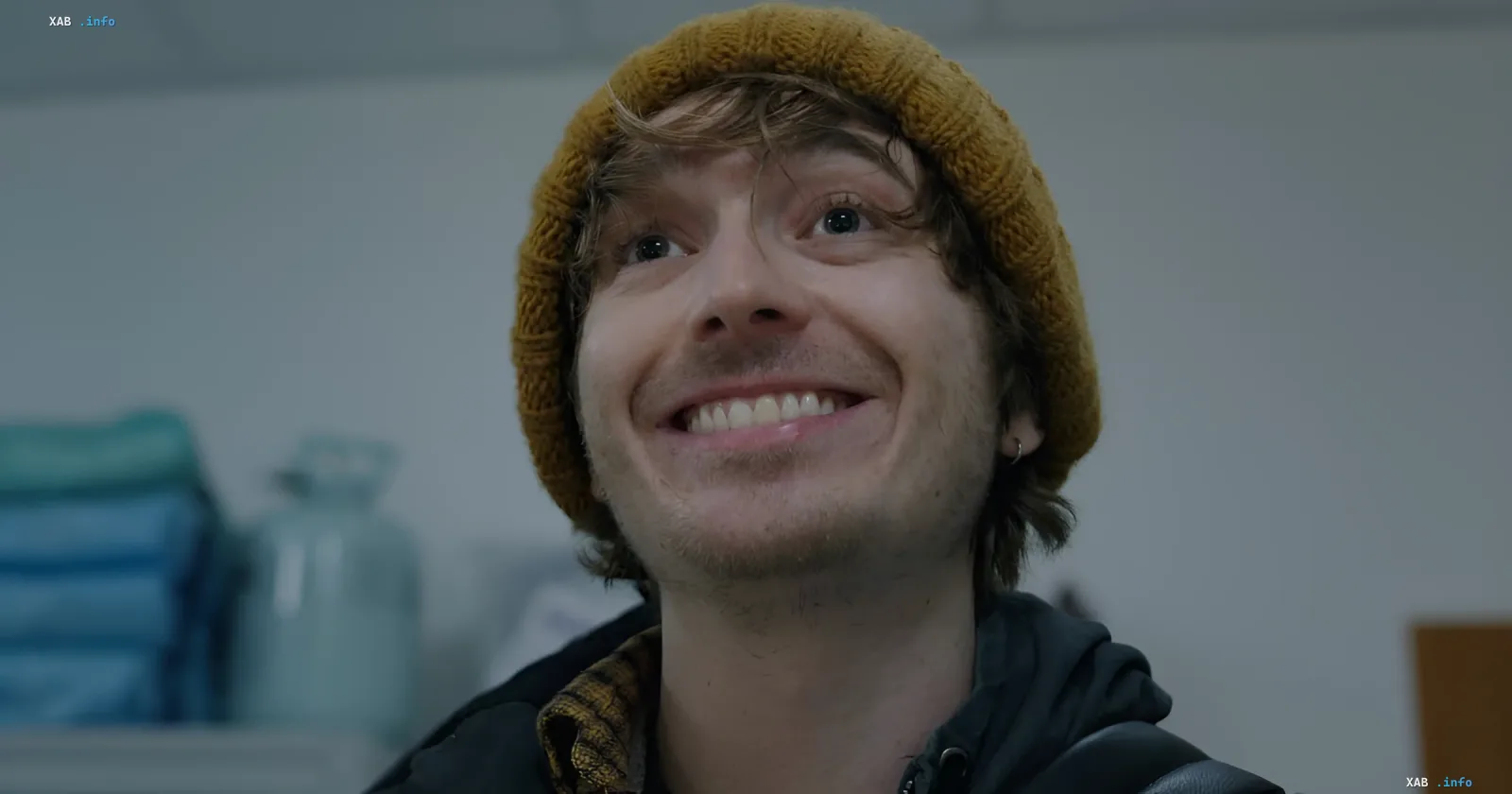 Actor in yellow beanie smiling — part of new Resident Evil casting from 'Euphoria' to 'The Black Bird'