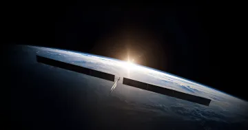 SpaceX orbital data center with solar panels against the backdrop of Earth and a rising sun, symbolizing the future of cloud computing in space