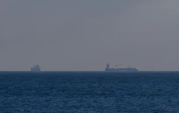 Cargo ships in the open sea, illustrating the risks of shipping in the Black Sea amid Ukraine's call to avoid Russian ports