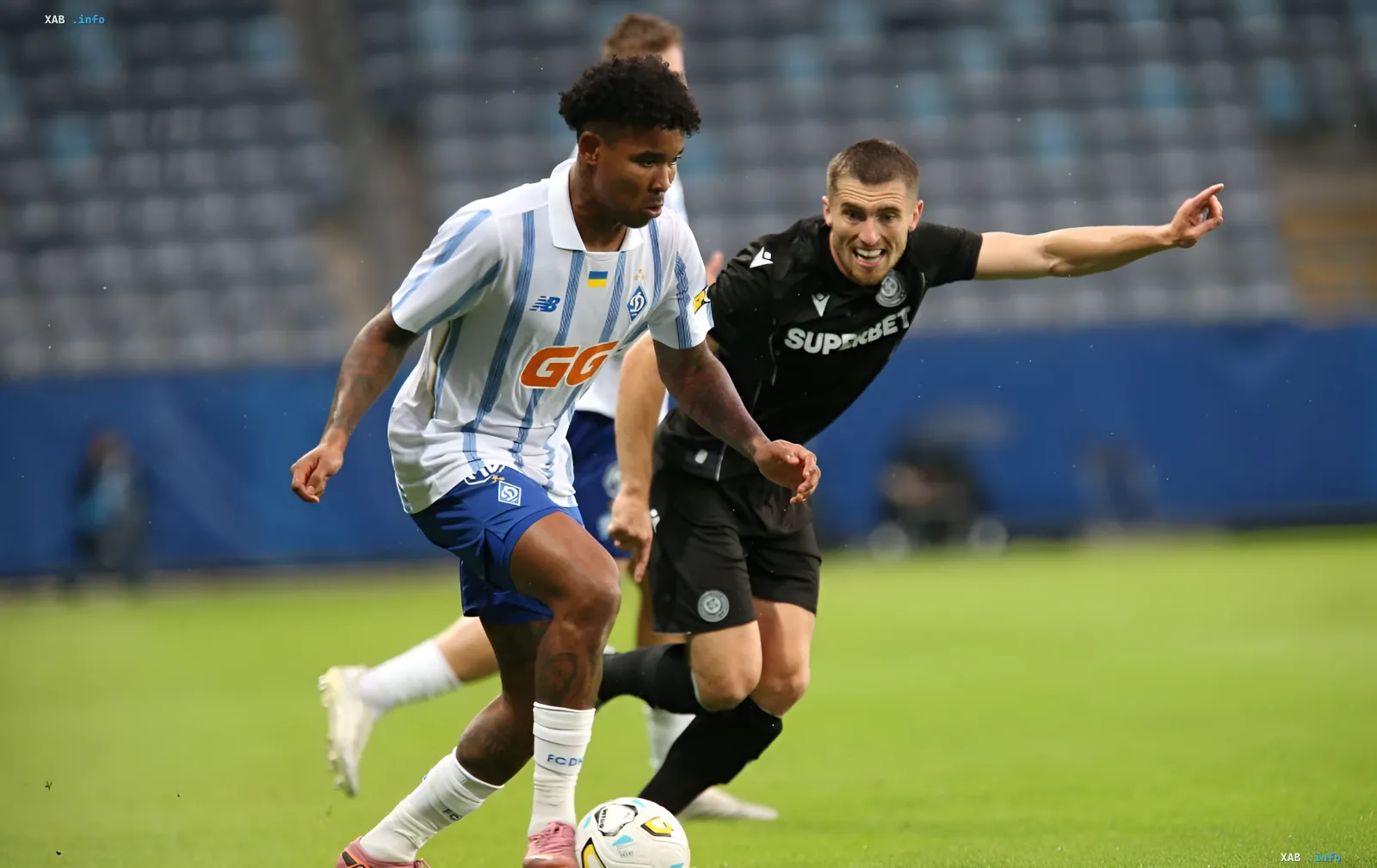 FC 'Dnipro-1' player battling for the ball against an opponent in a Conference League match