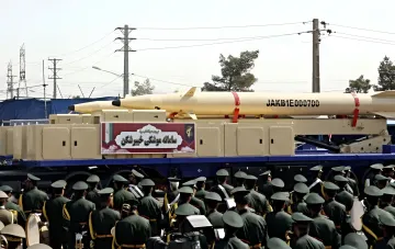 Iranian ballistic missile Kheibar Shekan on a mobile launcher during a military parade, demonstrating threat to air defense systems