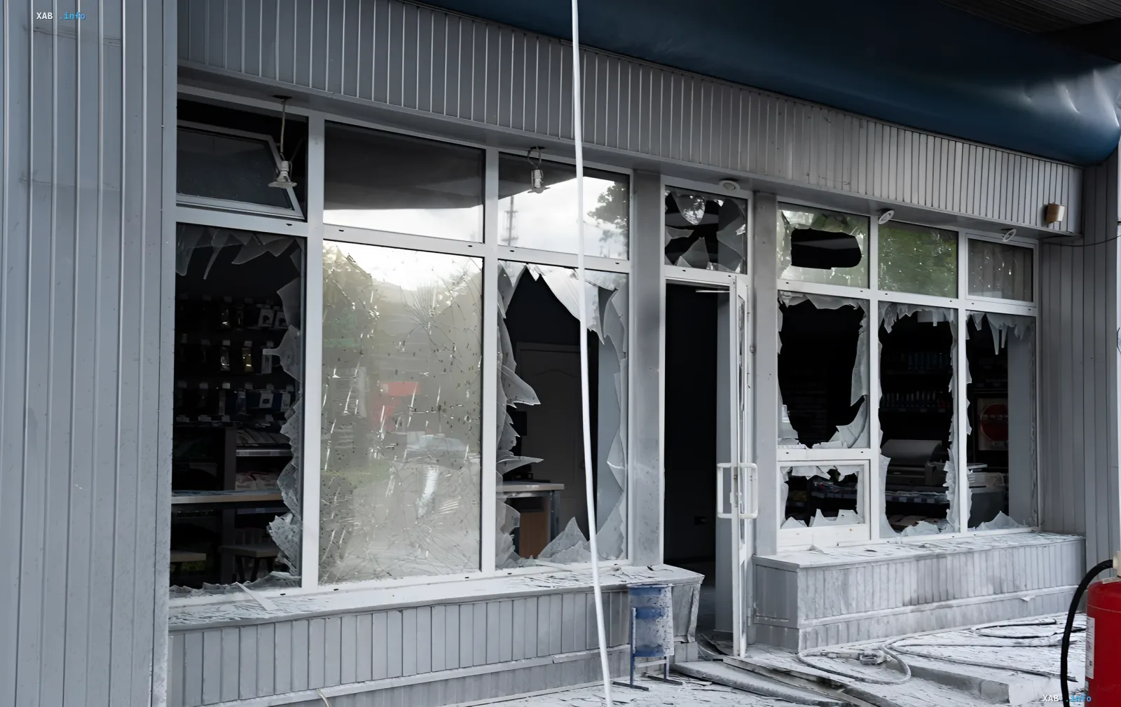 Shattered windows of a gas station in Saltivskyi district of Kharkiv after a Russian drone strike, explosion aftermath and damaged building