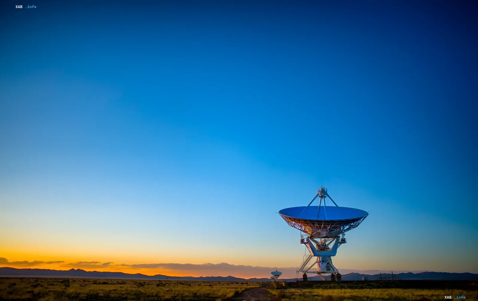 Radio telescope at sunset: symbol of the search for signals from space and the lack of a plan for contact with aliens