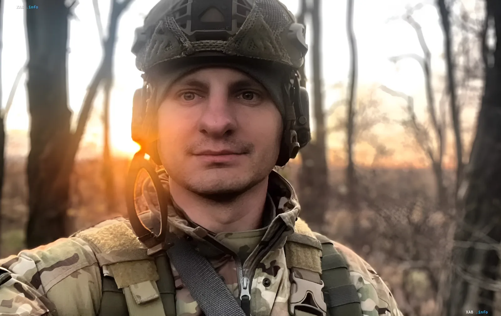 Reid Battalion Commander Yevhen Karasyov in military gear against a sunset backdrop after wedding with actress Kateryna Shvendenko