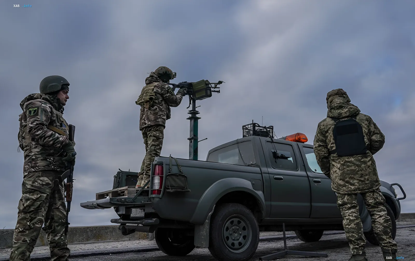 Ukrainian soldiers on a pickup truck with an anti-drone air defense system, repelling a massive drone attack amid uncertainty over US aid