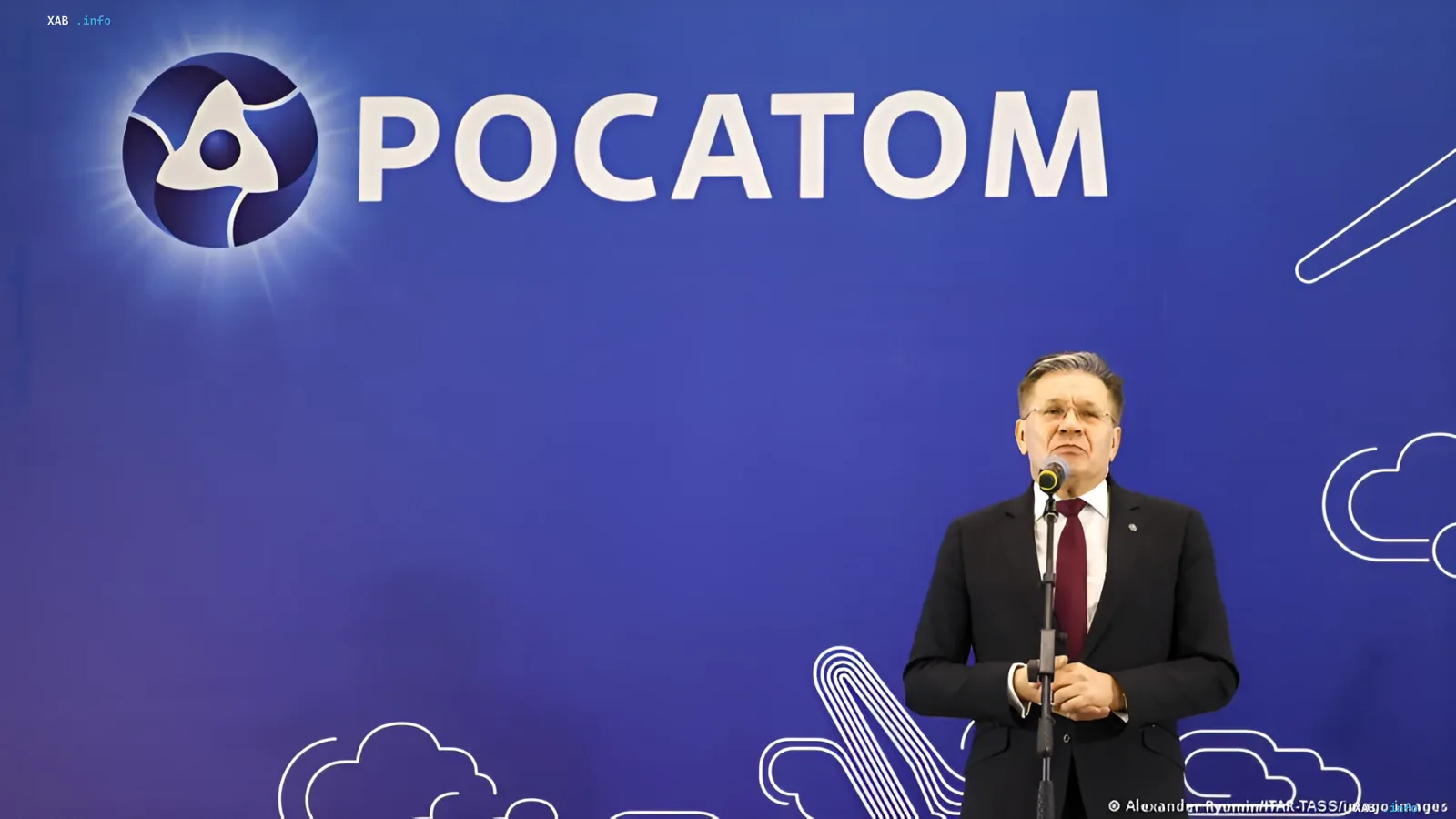 Rosatom representative speaks at a press conference in front of the company logo, discussing the incident with the sunken container ship 'Yanina' in the Black Sea