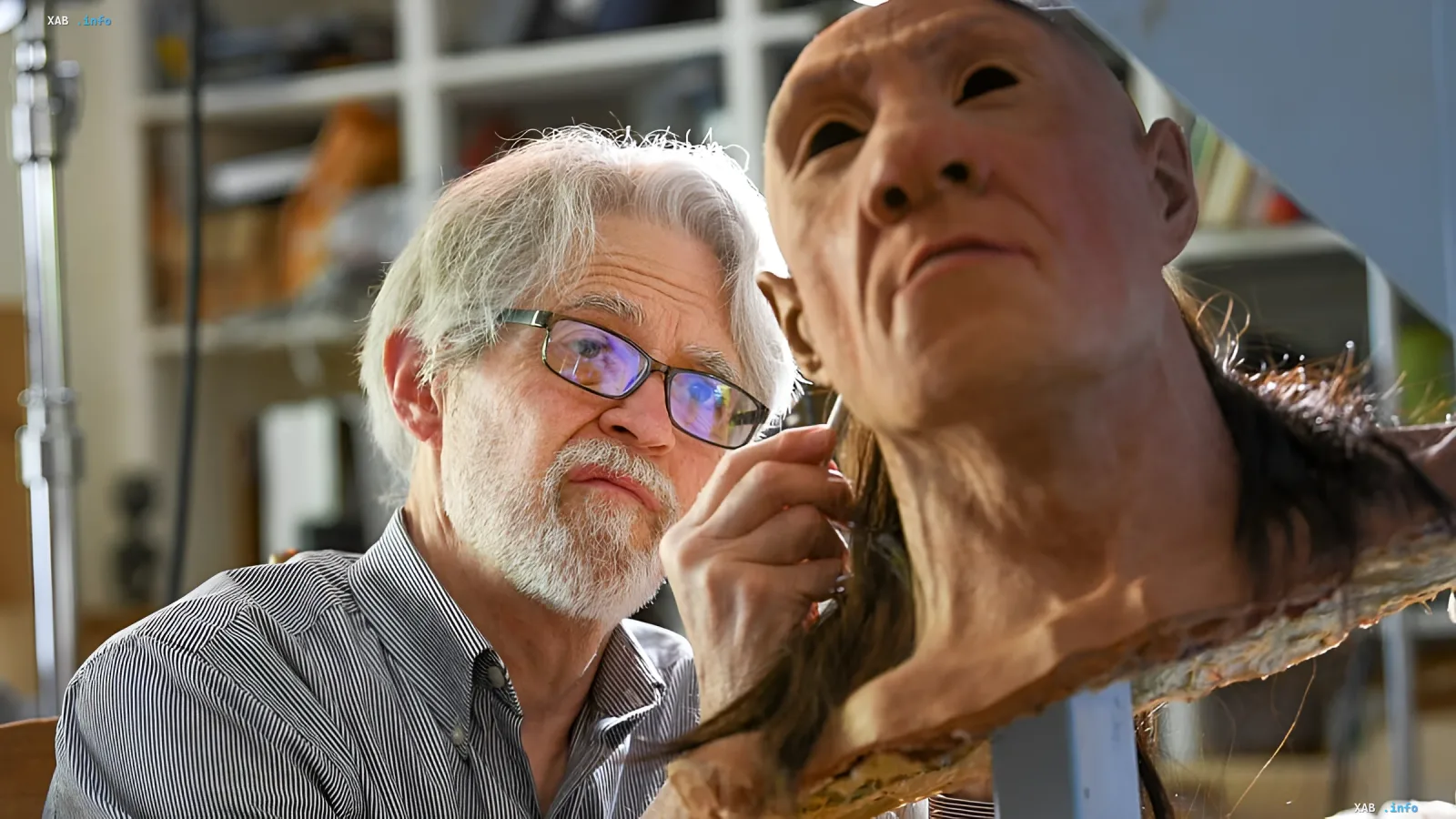 Anthropologist examining a reconstruction of an ancient human face, illustrating the discovery of unknown species in the Homo sapiens genome