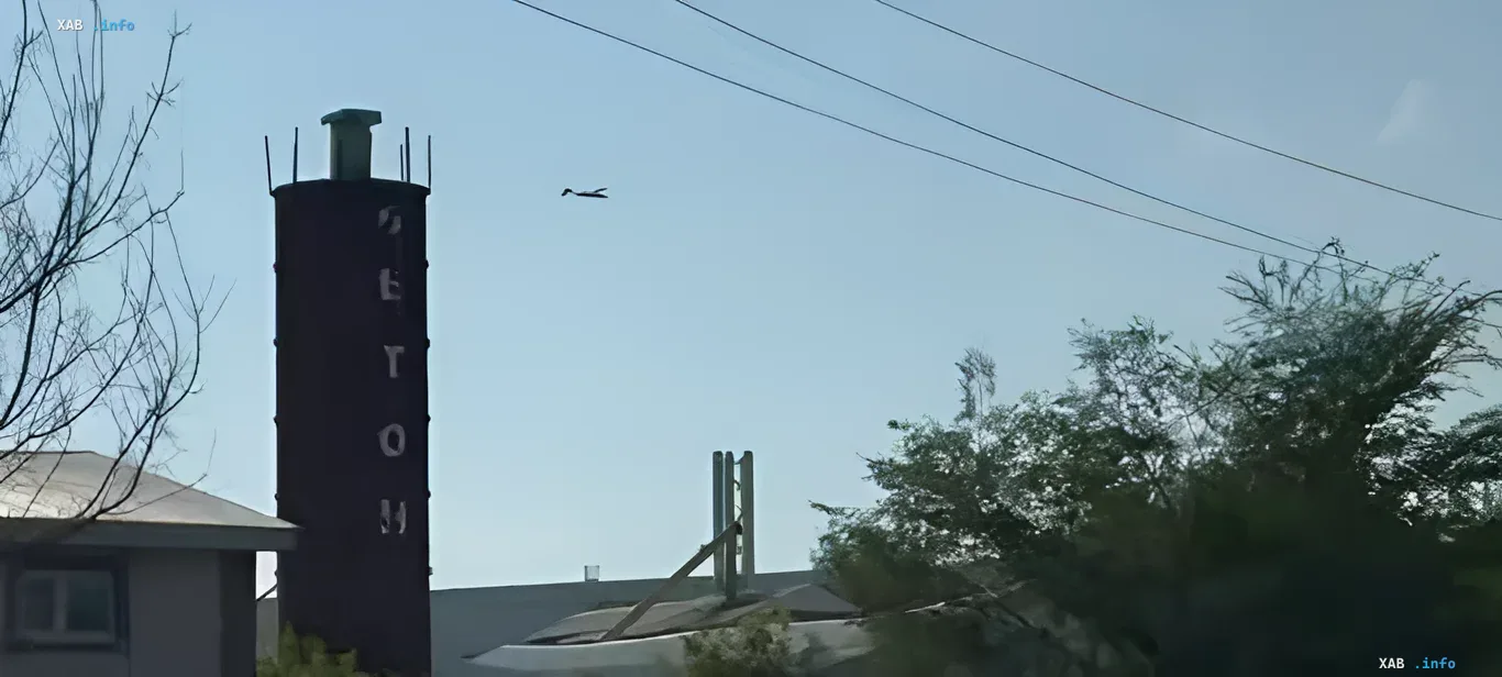 Footage of the explosion at the Wildberries warehouse: smoke over the industrial facility View of an industrial facility with a tower and smoke in the sky, footage of the explosion at the Wildberries warehouse in the Saratov region