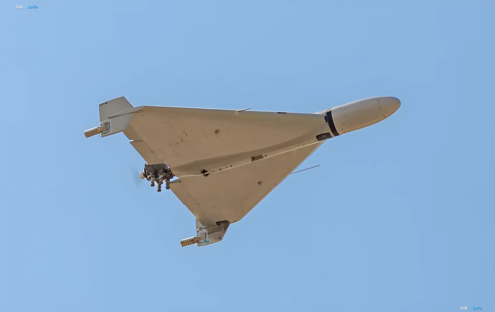 White kamikaze drone flying in the sky, illustrating drone attacks in Chernihiv