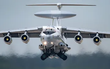 Russian A-50U airborne warning and control system aircraft in flight with deployed landing gear, symbolizing increased air reconnaissance over Russia