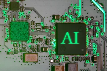 Микросхема с надписью AI на печатной плате, символизирующая перегрузку службы безопасности Apple из-за ИИ-спама