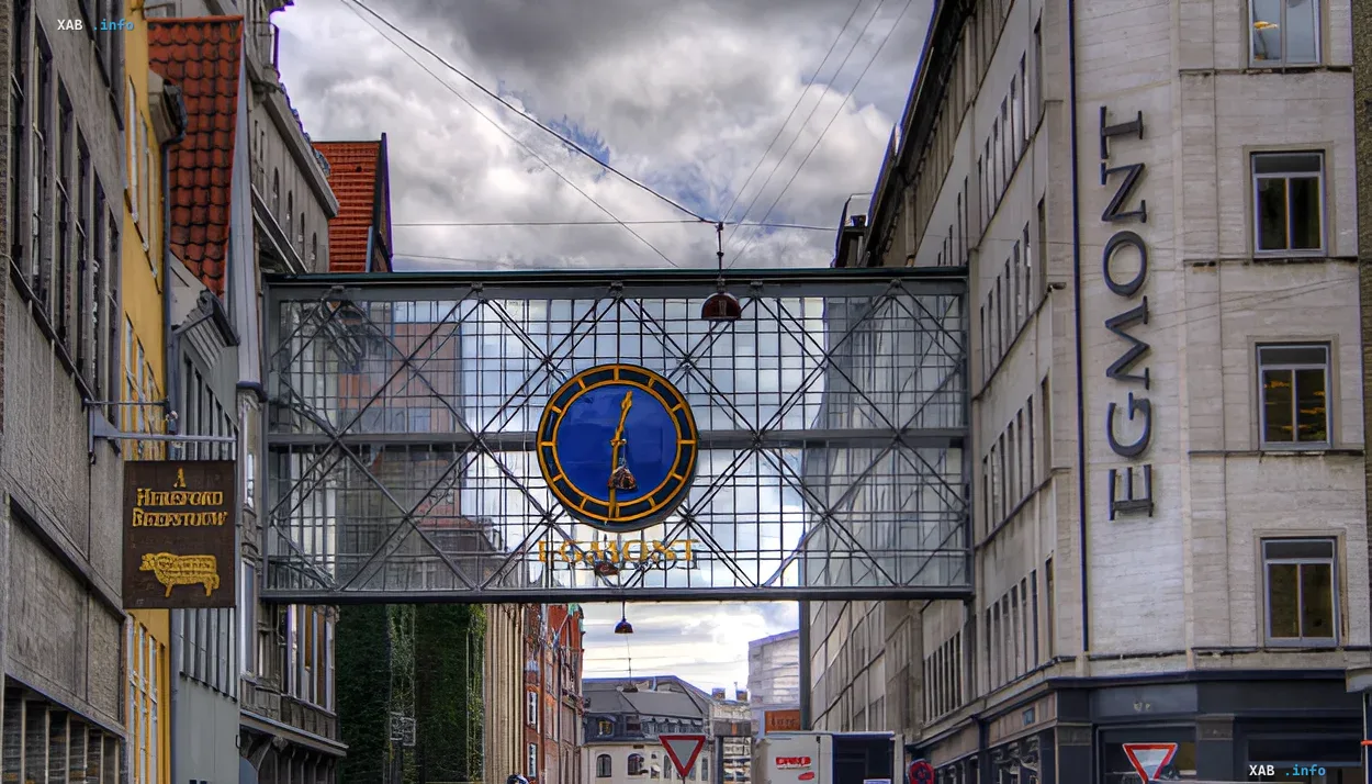 Egmont Group building with distinctive glass bridge and clock, symbolizing reliable protection for banks against money laundering