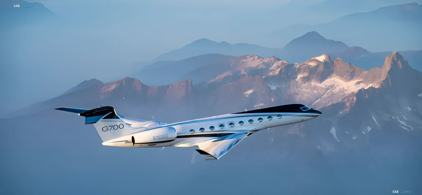Gulfstream G700 business jet in flight over mountains, showcasing record-breaking speed on transatlantic route