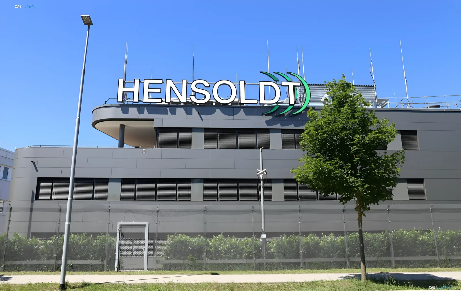 Building with Hensoldt logo — new engineering center established on the former Bosch plant site, symbolizing the mass transition of automotive specialists to defense industry