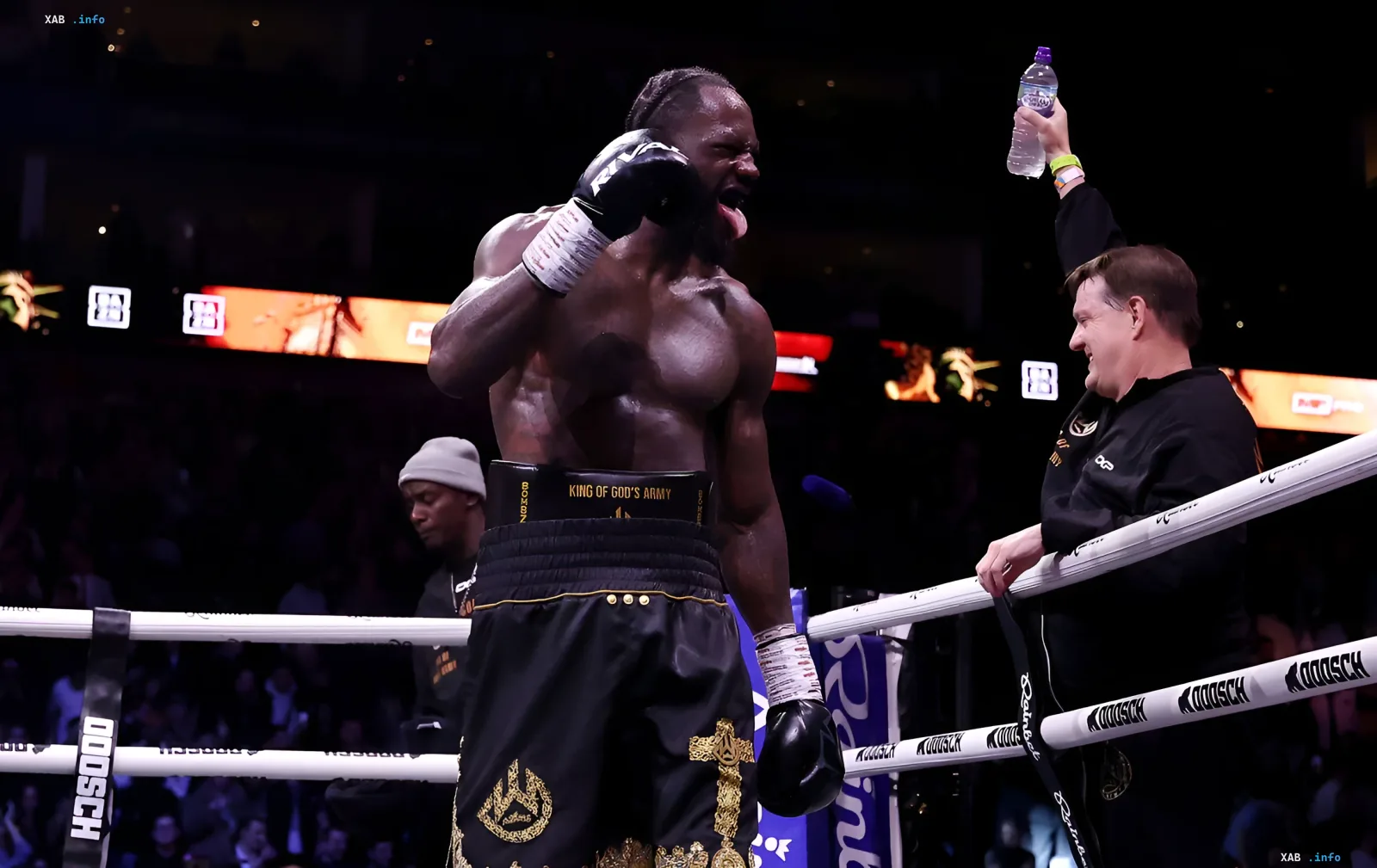 Derek Chisora celebrating victory in the ring, shouting with joy, trainer handing water — Wilder fight discussed