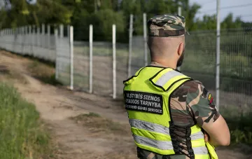 Lithuanian State Border Guard Service officer patrols the border with Belarus after discovery of third tunnel in a week
