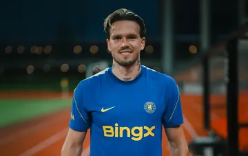 Mykhailo Mudryk in Chelsea kit on the pitch after returning from suspension