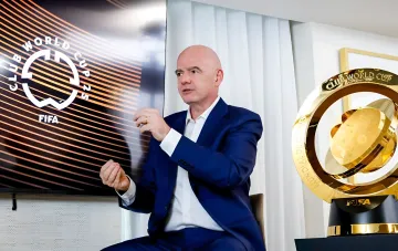 Gianni Infantino against the backdrop of the FIFA Club World Cup 2025 logo and trophy, symbolizing the trust crisis in FIFA