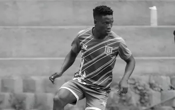 David Owori, captain of SC Villa football club, in action on the field