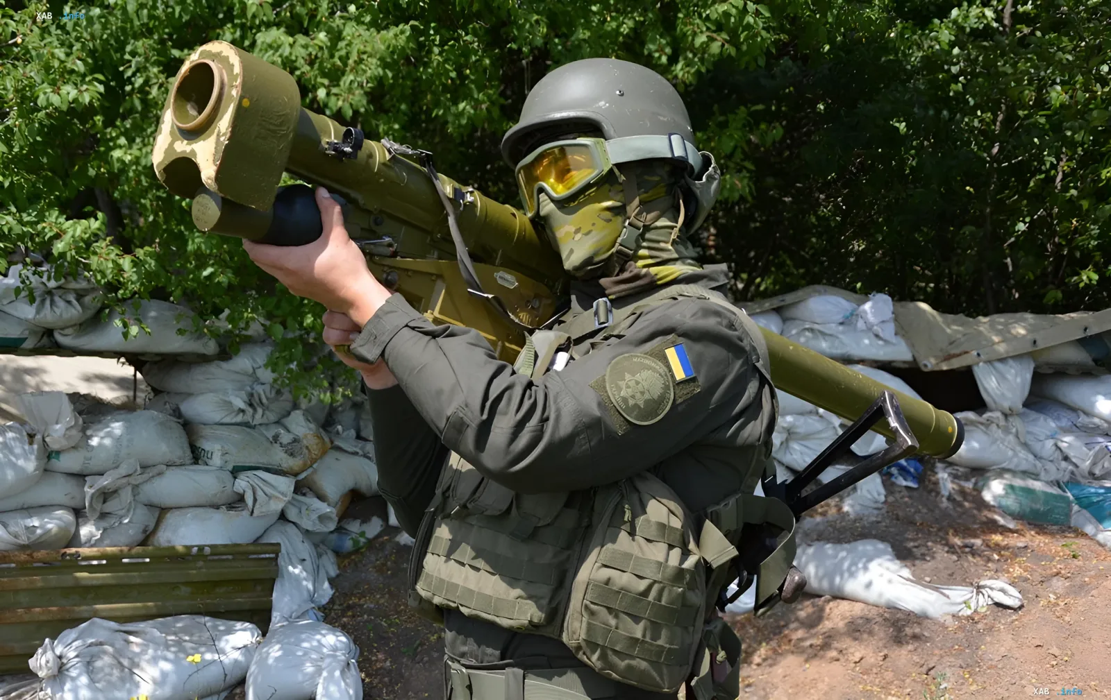Ukrainian soldier with ATGM ready to repel an attack against a backdrop of sandbags