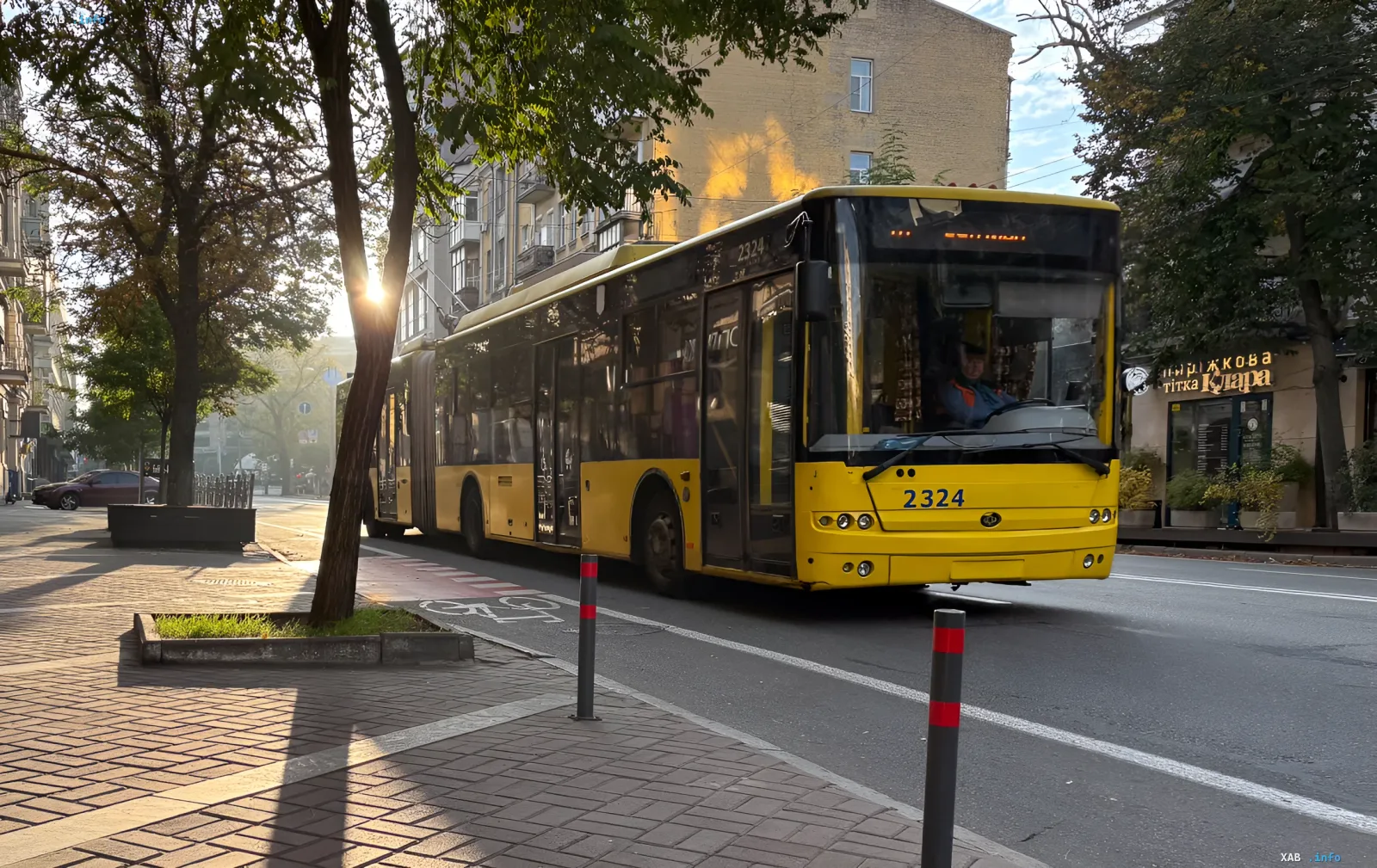 Yellow city bus No. 2324 driving down a street in Kyiv, illustrating the current state of public transport ahead of expected changes in August 2026