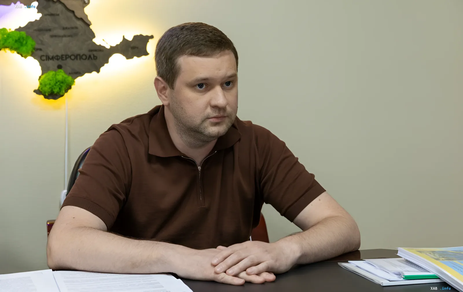 Deputy General Prosecutor of Ukraine Maxim Krym at his desk discussing the crisis of powers and protection of state interests
