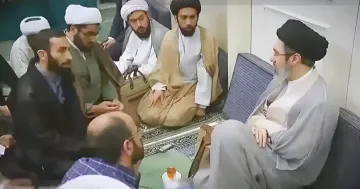 Mojtaba Khamenei surrounded by associates in the first published video refuting rumors of his critical condition