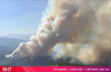 Massive smoke plume from wildfire in British Columbia, illustrating the 2026 climate disaster