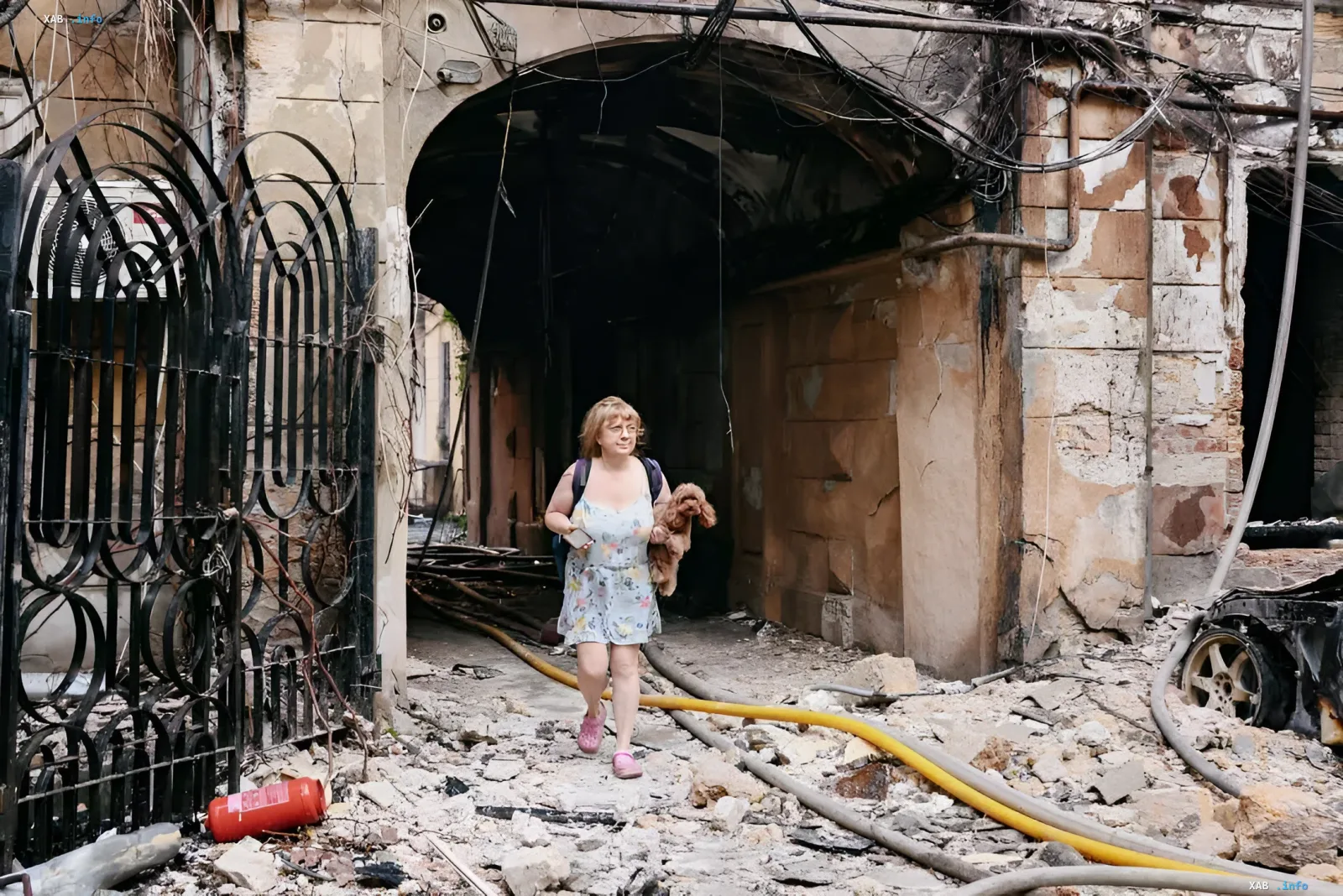 Destruction in Odesa: aftermath of the city strike Woman with a dog walking through a destroyed building in Odesa after the second strike on August 9