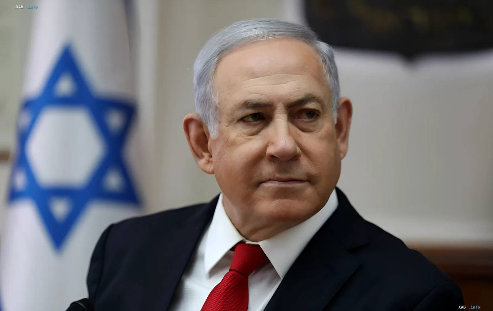 Benjamin Netanyahu in front of the Israeli flag, rejecting US plan to withdraw troops from Gaza