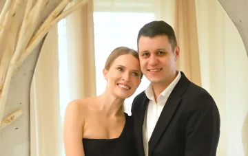 Roman Grishchuk and Anna Gres on official photo before announcing divorce — smiling, yet eyes reflect the complexity of the moment