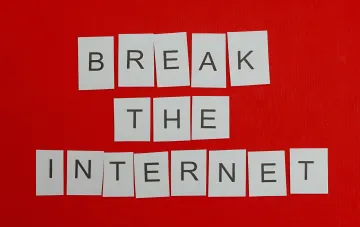 White cards spelling 'BREAK THE INTERNET' on a red background, symbolizing the shift from legacy browsers to AI-powered private browsers in 2026