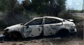 Burnt-out car on the roadside in Odesa region after a strike on a tanker truck