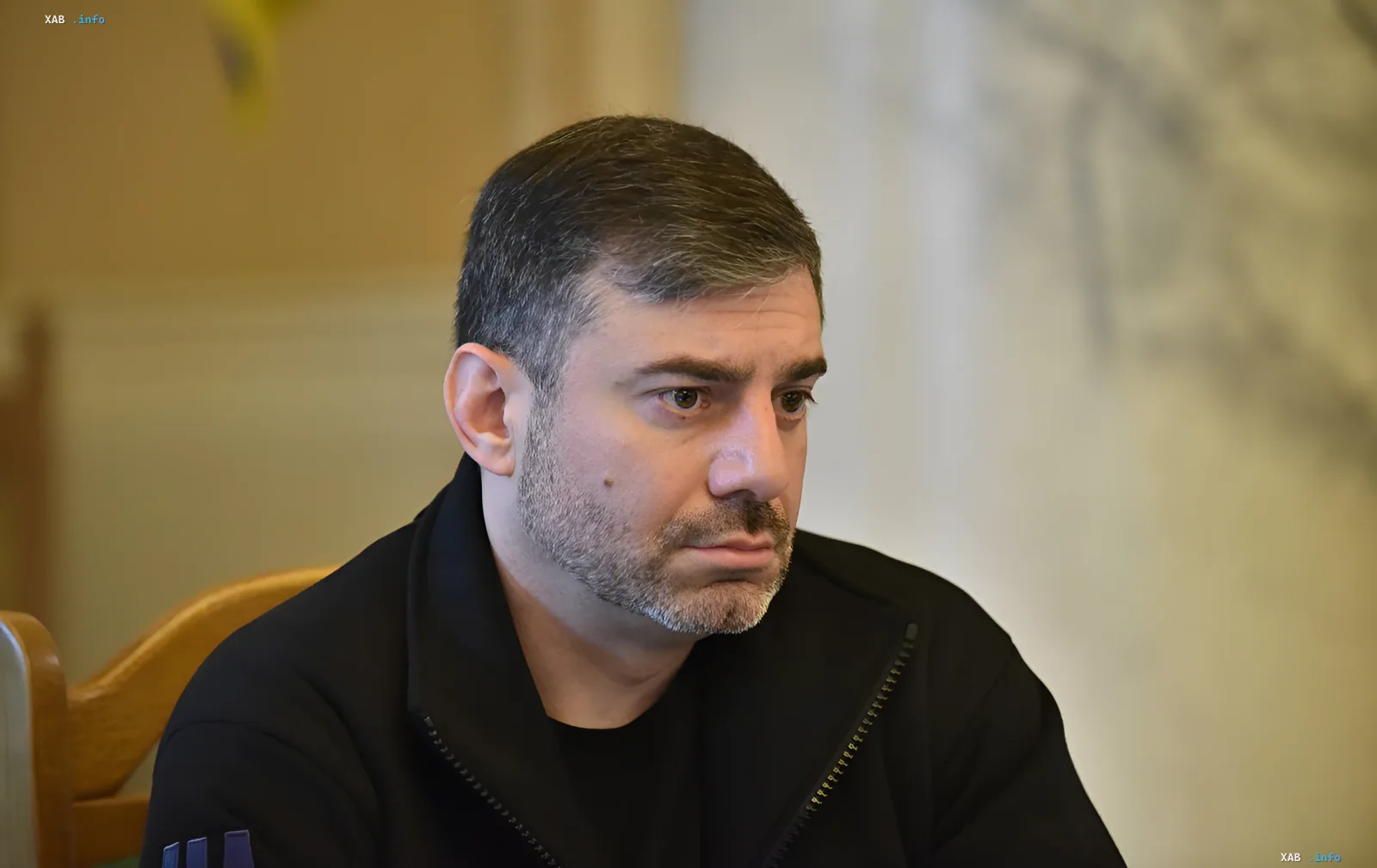 Dmytro Drapaty in deep thought, discussing ombudsman's recommendations on mobilization