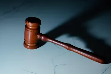 Judge’s gavel on marble table — symbol of court ruling on lawsuits against Meta, Google, and TikTok over teen digital addiction