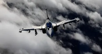 Saab Gripen fighter jet in flight against clouds: Colombia demands review of 3 billion euro contract price