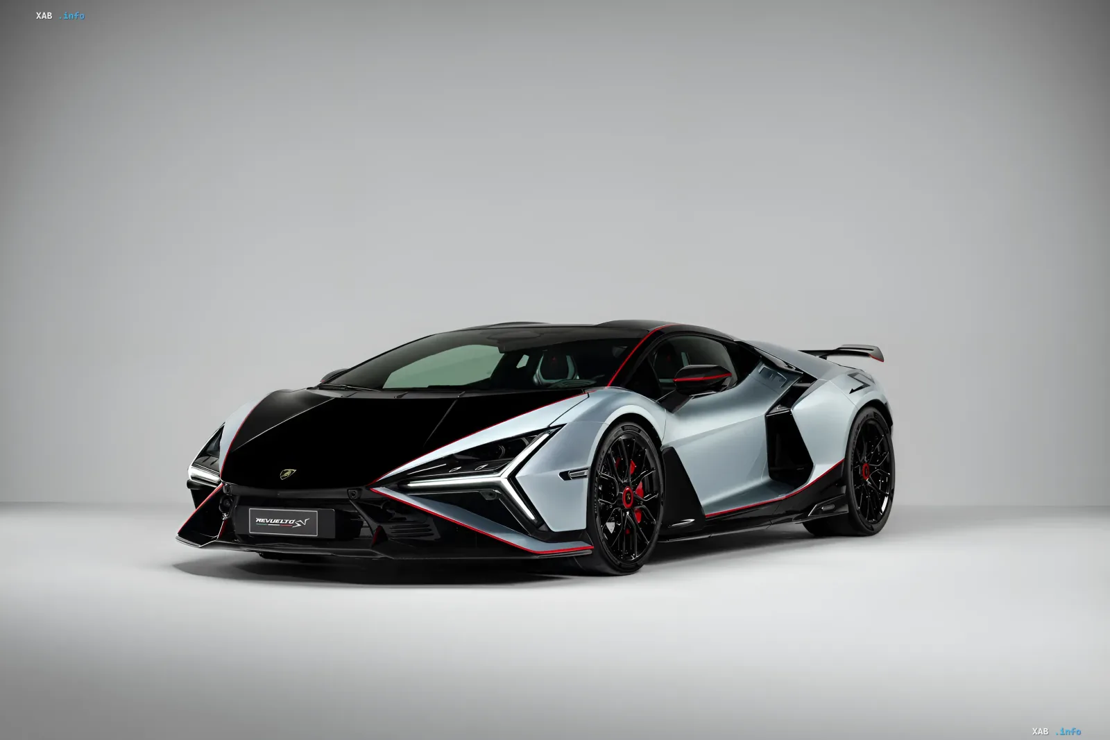 Lamborghini Revuelto SV sports car in silver with a black hood and red accents, showcasing extreme performance and design