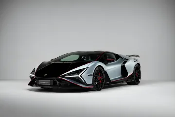Lamborghini Revuelto SV sports car in silver with a black hood and red accents, showcasing extreme performance and design