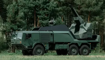 Polish SAN anti-drone system mounted on Jelcz 3 chassis in a forested area, part of Poland's enhanced air defense program