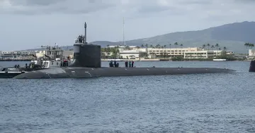 US Navy nuclear submarine in harbor, illustrating the topic of creating a new reconnaissance submarine to replace USS Jimmy Carter