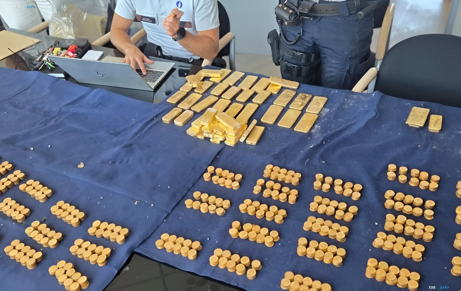 Gold bars and coins seized by police during the investigation of a treasure trove found in a Belgian brewery