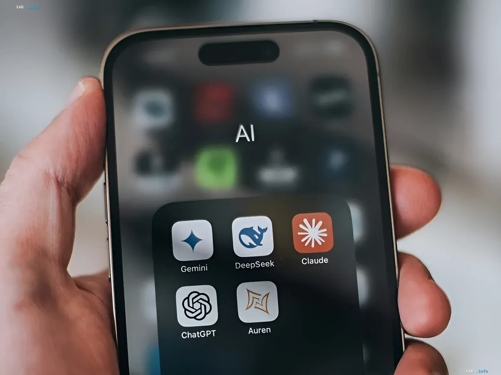 Smartphone displaying AI folder with icons of DeepSeek, Gemini, Claude, ChatGPT, and Auren — visualizing modular architecture for autonomous AI agents