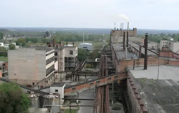 VostokGOK industrial complex with smokestacks and conveyor belts, symbolizing vertical integration in Ukraine’s energy sector