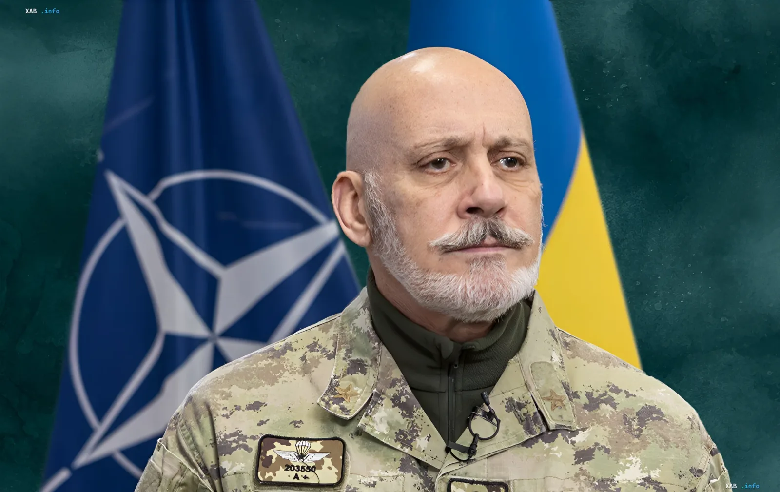 Генерал ВСУ на фоне флагов НАТО и Украины в контексте визита Военного комитета НАТО в Киев и обсуждения приоритетов с Драпатим