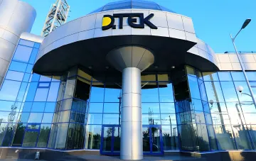 DTEK corporate headquarters building with the company logo against a clear blue sky — DTEK of Rinat Akhmetov paid 29.6 billion UAH in taxes to budgets in the first half of 2026